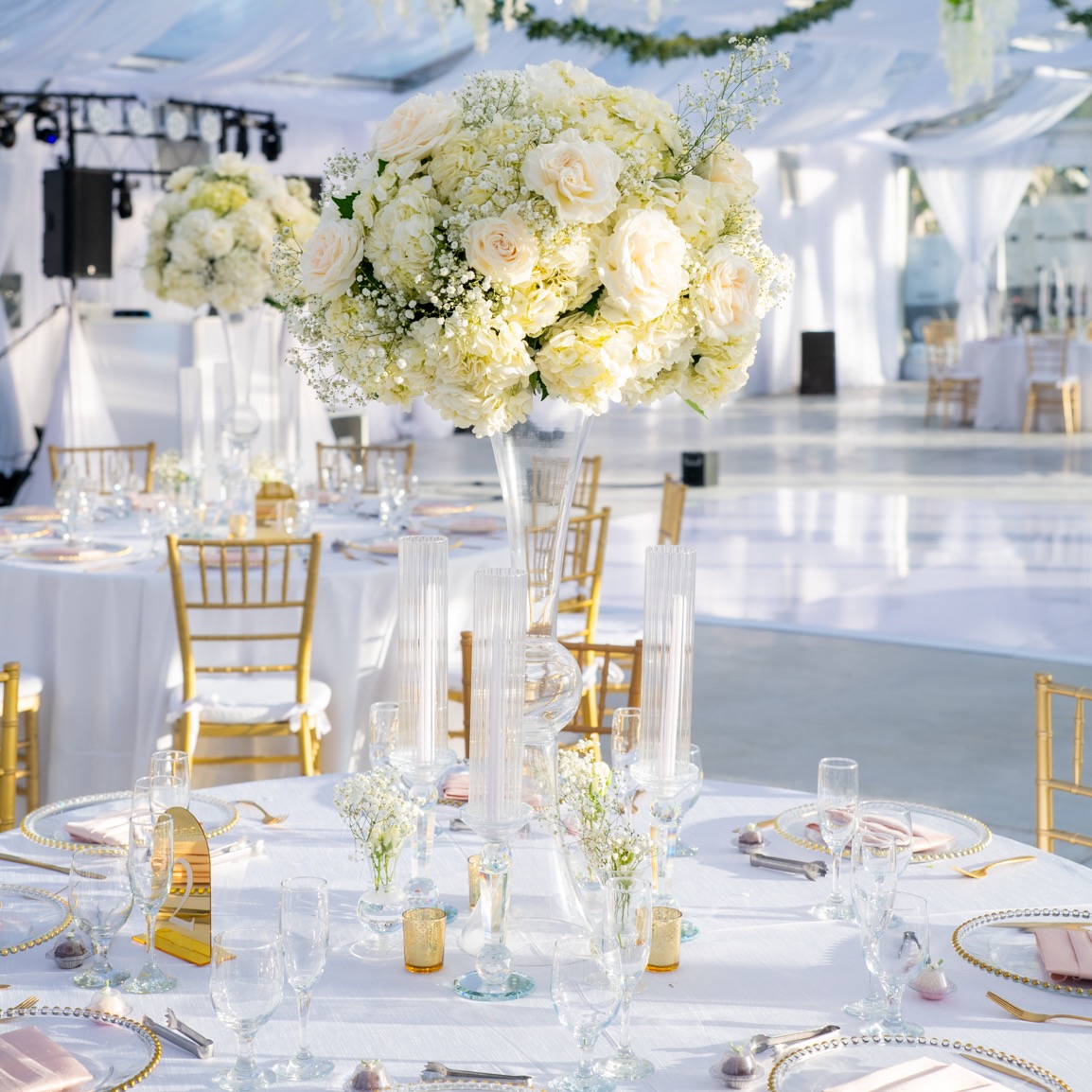 tall white floral centerpiece for wedding reception
